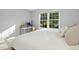 Bedroom with a bright window and desk offering a comfortable and peaceful living space at 1208 Manassas Ct # A, Raleigh, NC 27609