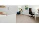 Bright bedroom featuring a white study table, ergonomic chair, and a serene backyard view at 1208 Manassas Ct # A, Raleigh, NC 27609