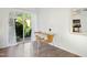 Cozy dining area with a table and chairs next to a sliding glass door with outdoor views at 1208 Manassas Ct # A, Raleigh, NC 27609