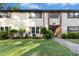 Inviting condo featuring tidy landscaping, charming shutters, and clearly marked unit numbers at 1208 Manassas Ct # A, Raleigh, NC 27609