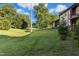 Exterior view showcasing a spacious and well-maintained green lawn at 1208 Manassas Ct # A, Raleigh, NC 27609