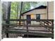 Exterior view of back deck attached to home overlooking wooded lot at 125 Forsyth Dr, Chapel Hill, NC 27517