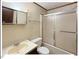 Full bathroom with tub-shower combination and tiled walls at 125 Forsyth Dr, Chapel Hill, NC 27517
