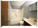 Bathroom with a combined tub and shower unit, with modern fixtures at 125 Forsyth Dr, Chapel Hill, NC 27517