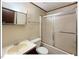 Full bathroom with tub-shower combination and tiled walls at 125 Forsyth Dr, Chapel Hill, NC 27517