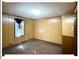 Bedroom with wood paneling and carpeting at 125 Forsyth Dr, Chapel Hill, NC 27517