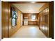 Traditional kitchen with wood paneling, tile floors, and an electric range at 125 Forsyth Dr, Chapel Hill, NC 27517