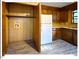 Kitchen with wooden cabinets, white appliances and storage at 125 Forsyth Dr, Chapel Hill, NC 27517