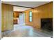 Open living area with a fireplace and views into the kitchen at 125 Forsyth Dr, Chapel Hill, NC 27517
