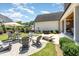 Beautiful backyard oasis featuring a fire pit, patio, professional landscaping, and ample seating at 12500 Richmond Run Dr, Raleigh, NC 27614