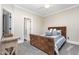 Bright bedroom with a decorative bedframe and neutral paint at 12500 Richmond Run Dr, Raleigh, NC 27614