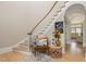 Elegant foyer featuring hardwood floors, staircase, chair and beautiful decor at 12500 Richmond Run Dr, Raleigh, NC 27614