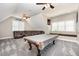 Spacious game room with pool table, leather sectional and multiple windows at 12500 Richmond Run Dr, Raleigh, NC 27614
