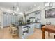 Spacious kitchen features large center island with seating and gray cabinetry with stainless appliances at 12500 Richmond Run Dr, Raleigh, NC 27614