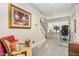 Comfortable living room with grand artwork, elegant decor and staircase at 12500 Richmond Run Dr, Raleigh, NC 27614