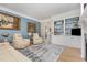 Elegant living room with hardwood floors, built-in shelving, and comfortable seating at 12500 Richmond Run Dr, Raleigh, NC 27614