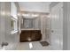 Well-lit bathroom with double sink vanity, tile flooring, and a glass-enclosed shower for a spa-like experience at 128 Potomac River St, Garner, NC 27529