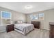 Cozy bedroom with neutral tones, soft carpeting, and plenty of natural light creating a serene retreat at 128 Potomac River St, Garner, NC 27529
