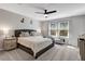Serene bedroom featuring a large bed, soft carpeting, and bright windows creating a calming atmosphere at 128 Potomac River St, Garner, NC 27529