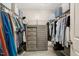 Walk-in closet with built-in shelves and rods, providing ample storage space at 128 Potomac River St, Garner, NC 27529