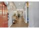 Inviting hallway leading to an open-concept dining area with natural light and a view of backyard at 128 Potomac River St, Garner, NC 27529