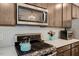 Kitchen with stainless steel appliances, modern tile backsplash and overhead microwave at 128 Potomac River St, Garner, NC 27529