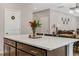 Bright kitchen island featuring white countertop and brown wooden cabinets, ready for cooking and entertaining at 128 Potomac River St, Garner, NC 27529