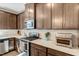 Kitchen featuring stainless steel appliances, quartz countertops, and tile backsplash at 128 Potomac River St, Garner, NC 27529