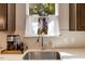Kitchen sink area with view of backyard through window and decor at 128 Potomac River St, Garner, NC 27529