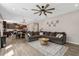 Open-concept living room with a large sofa and view to the kitchen at 128 Potomac River St, Garner, NC 27529