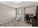 Well-lit office with a large window, desk, and chair at 128 Potomac River St, Garner, NC 27529