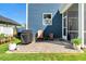 Outdoor patio featuring a grill, seating, and manicured plants, perfect for entertaining and relaxation at 128 Potomac River St, Garner, NC 27529