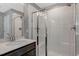 Modern shower with tiled walls, glass doors, and sleek fixtures, offering a luxurious bathing experience at 128 Potomac River St, Garner, NC 27529
