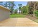 Spacious backyard with new deck and lush green space at 128 W Parker St, Henderson, NC 27536