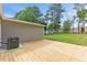 Spacious backyard with new deck and lush green space at 128 W Parker St, Henderson, NC 27536