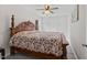 Bedroom featuring ceiling fan, closet, and comfortable bed at 128 W Parker St, Henderson, NC 27536
