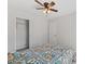 Bedroom with ceiling fan, closet, and comfortable bed at 128 W Parker St, Henderson, NC 27536