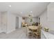 Open-concept living and dining area with hardwood flooring and recessed lighting at 128 W Parker St, Henderson, NC 27536