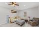 Comfortable living room with neutral colors, plank flooring, and ample seating at 128 W Parker St, Henderson, NC 27536