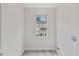 Room featuring large window and modern flooring at 128 W Parker St, Henderson, NC 27536