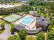 Community amenities, including a pool, tennis courts, playground, and clubhouse, surrounded by green spaces at 1304 Revolution Cir, Raleigh, NC 27603