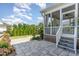 Outdoor patio showcasing screened-in porch, pavers, and landscaped yard creating an inviting outdoor space at 1304 Revolution Cir, Raleigh, NC 27603