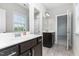 Well-lit bathroom with a double sink vanity, tiled floor, and a shower/tub combo at 1304 Revolution Cir, Raleigh, NC 27603