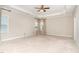 Expansive bedroom featuring large windows and carpeted floors at 1304 Revolution Cir, Raleigh, NC 27603