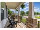 Relaxing front porch featuring comfortable seating and hanging plants, perfect for outdoor enjoyment at 1304 Revolution Cir, Raleigh, NC 27603