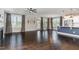 Open-concept living room with hardwood floors, fireplace, and access to outdoor space at 1304 Revolution Cir, Raleigh, NC 27603