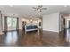 Open concept living area features hardwood floors, recessed lighting, and a view into the modern kitchen at 1304 Revolution Cir, Raleigh, NC 27603