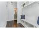 Mud room with bench seating, cubbies, and access to a full bathroom at 1304 Revolution Cir, Raleigh, NC 27603