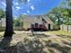 A view of the home's backyard, showing the deck, siding, and yard at 1305 Shakentown St, Knightdale, NC 27545