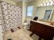 Bathroom with neutral walls, a tiled floor, vanity, toilet, and bathtub at 1305 Shakentown St, Knightdale, NC 27545